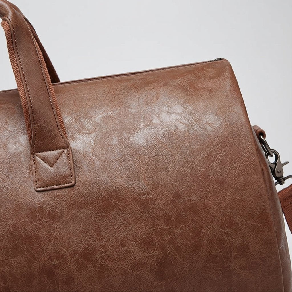 Weekender bag for women featuring a spacious interior and durable design, perfect for overnight travel and versatile use. 3