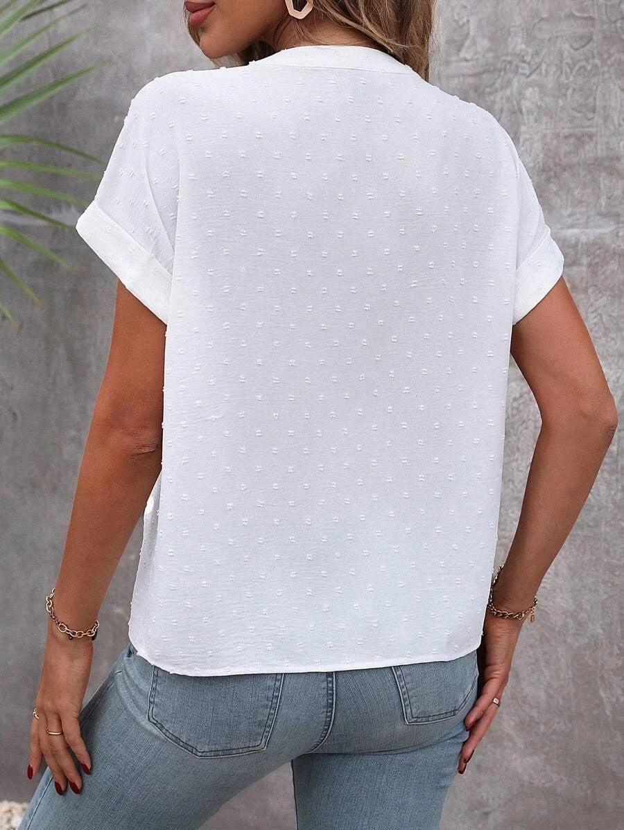 Lightweight white blouse featuring button detail and a V-neck design, crafted from Swiss dot fabric, perfect for summer wear for women. 2