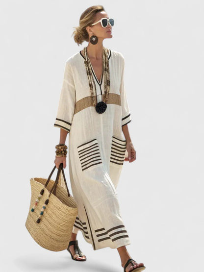 White long sleeve maxi dress featuring a flattering fit, perfect for elegant occasions and comfortable wear, showcasing a beautiful floor-length design. 2