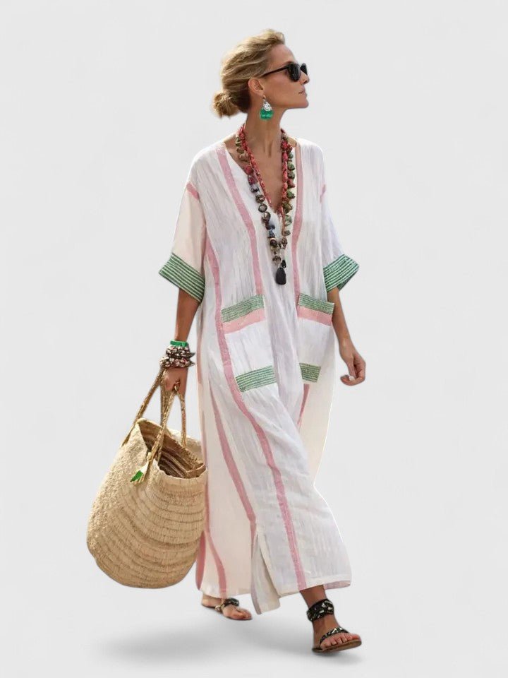 White long sleeve maxi dress featuring a flattering fit, perfect for elegant occasions and comfortable wear, showcasing a beautiful floor-length design. 1
