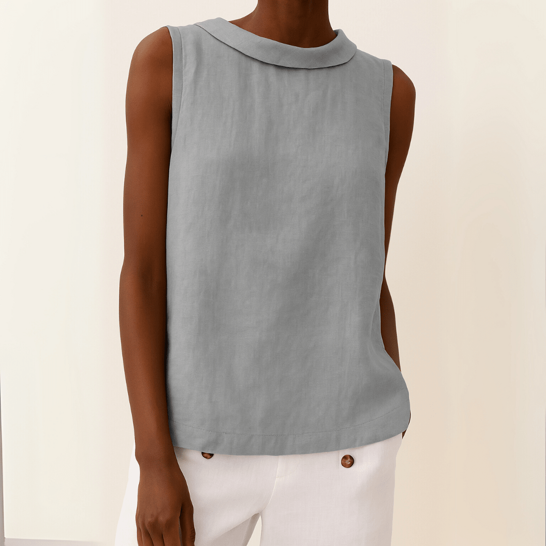 White sleeveless top with a rolled collar, perfect for summer, showcasing a chic and elegant design for women's fashion. 0