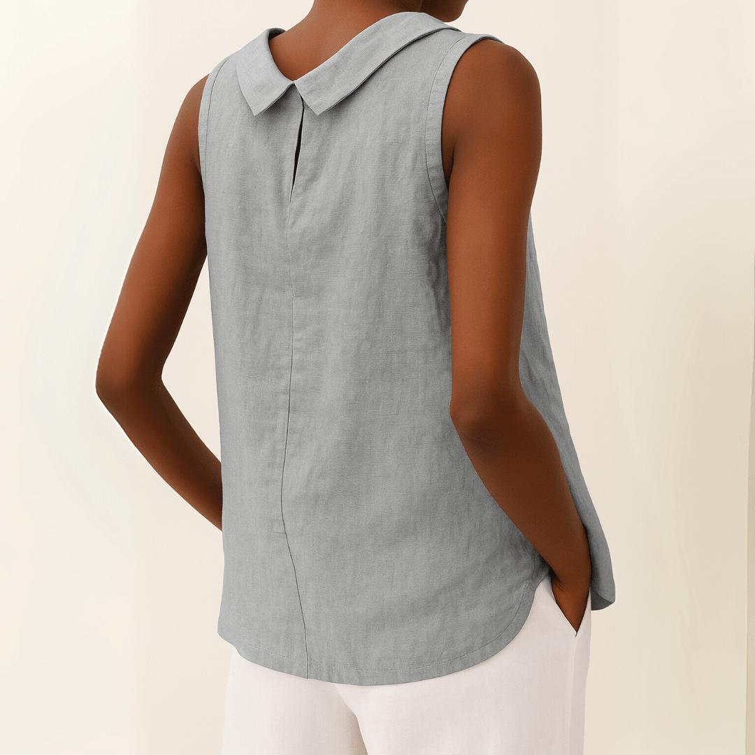 White sleeveless top with a rolled collar, perfect for summer, showcasing a chic and elegant design for women's fashion. 1