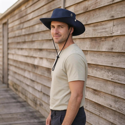 Wide brim bucket hat with adjustable chin strap for casual outdoor sun protection, made of polyester with a ventilated design. 3