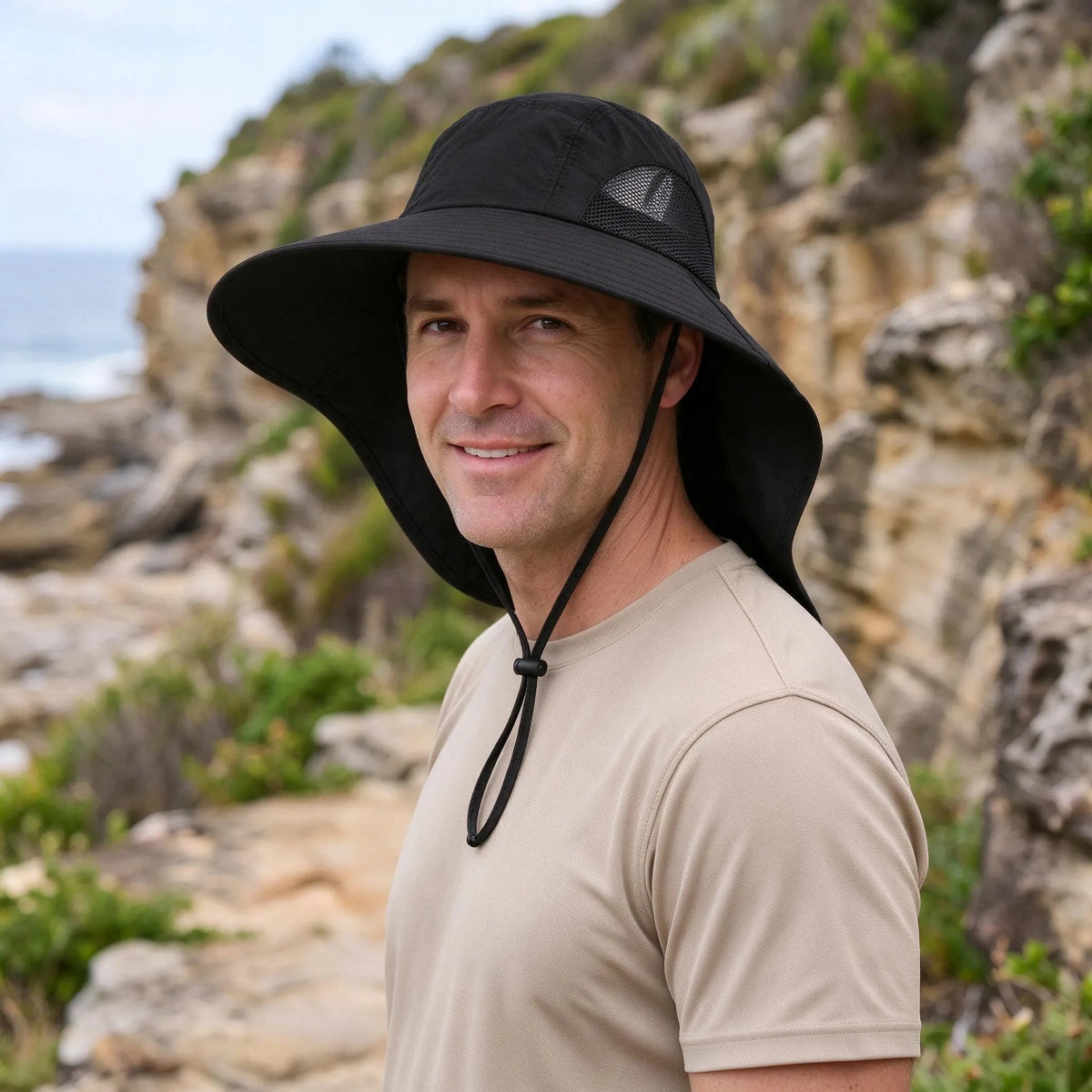 Wide brim bucket hat featuring UPF50+ sun protection, breathable mesh panels, and an adjustable leopard print design for stylish outdoor wear. 5