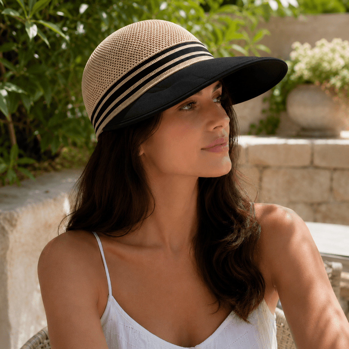 Wide brim sun hat with breathable knit crown and adjustable fit for women, designed for lightweight summer sun protection. 1