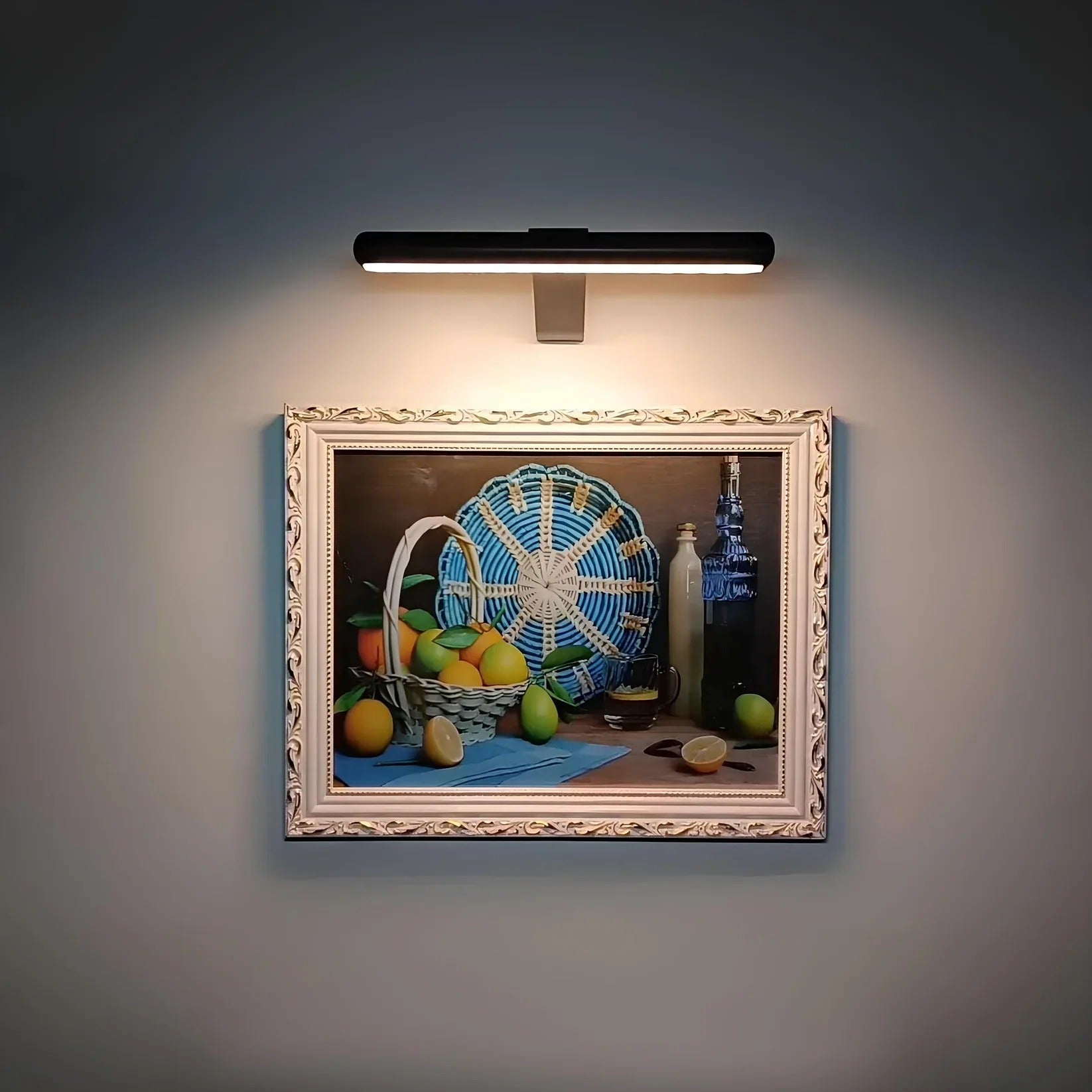 Wireless LED picture light featuring a sleek modern design, dimmable brightness, and a 360° rotating head, perfect for illuminating artwork and photographs; 6