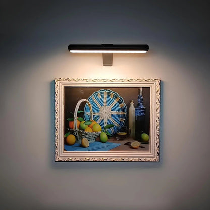 Wireless LED picture light featuring a sleek modern design, dimmable brightness, and a 360° rotating head, perfect for illuminating artwork and photographs; 6