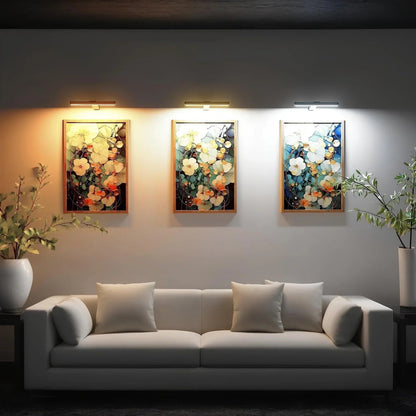 Wireless LED picture light featuring a sleek modern design, dimmable brightness, and a 360° rotating head, perfect for illuminating artwork and photographs; 3