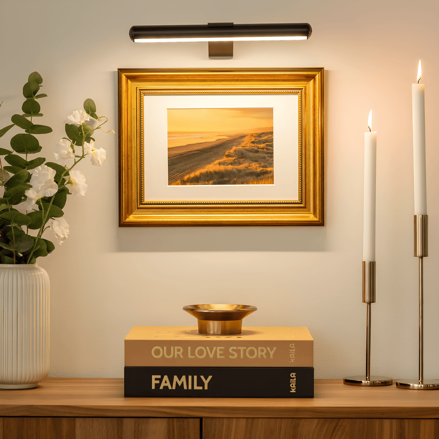 Wireless LED picture light featuring a sleek modern design, dimmable brightness, and a 360° rotating head, perfect for illuminating artwork and photographs; 1