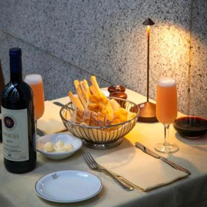 Wireless LED table lamp featuring adjustable dimmable brightness and a waterproof design, perfect for indoor and outdoor use, with a sleek modern appearance and cordless battery 7