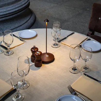 Wireless LED table lamp featuring adjustable dimmable brightness and a waterproof design, perfect for indoor and outdoor use, with a sleek modern appearance and cordless battery 2
