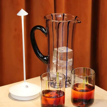 Wireless LED table lamp featuring adjustable dimmable brightness and a waterproof design, perfect for indoor and outdoor use, with a sleek modern appearance and cordless battery 3