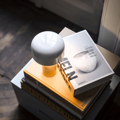Wireless metal table lamp featuring a sleek design, dimmable LED light, and a rechargeable battery for versatile lighting solutions in any space. 4