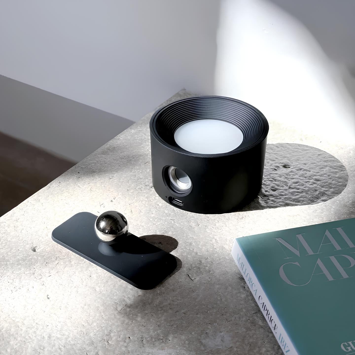 Wireless wall lamp featuring a minimalist design, 360° rotation, and dimmable LED, perfect for modern home decor and versatile lighting solutions. Recharge 4