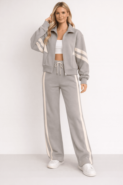Women's 2-Piece Training Set featuring a stylish zipper jacket and wide leg pants, designed in a modern sporty style with contrasting stripes for a chic workout 2