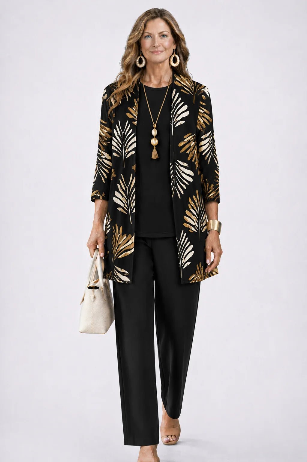 Women's 3-piece outfit set featuring a lightweight cardigan, a stylish tank top, and printed trousers, perfect for smart casual occasions. 10
