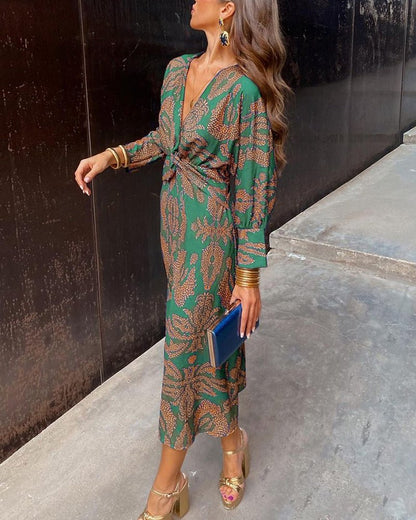 Women's A-Line Maxi Dress featuring an elegant V-neckline, designed for formal occasions with a flattering silhouette and stylish print. 1