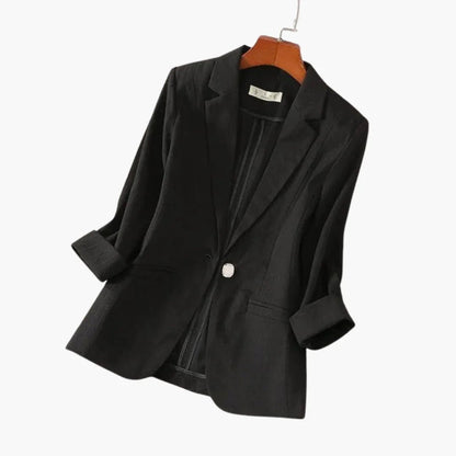 Women's black blazer featuring 3/4 sleeves and a stylish notched lapel, crafted from a lightweight linen blend for a chic and comfortable fit. 4