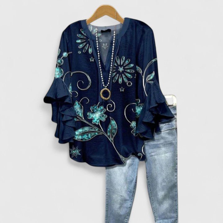 Women's blouse featuring an elegant floral print and stylish ruffled sleeves, designed for breathability and versatility in various settings. 8