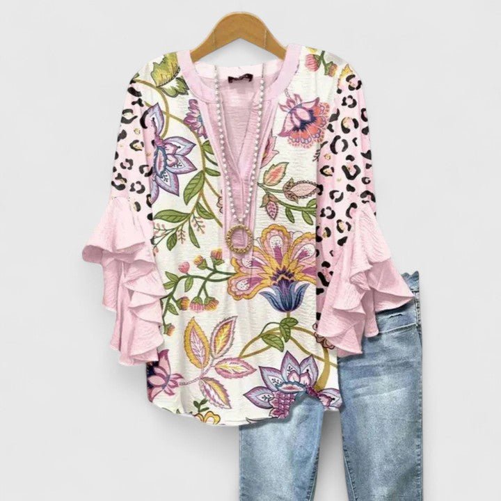 Women's blouse featuring an elegant floral print and stylish ruffled sleeves, designed for breathability and versatility in various settings. 7