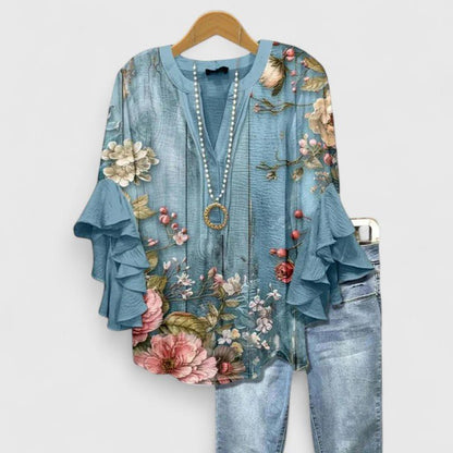 Women's blouse featuring an elegant floral print and stylish ruffled sleeves, designed for breathability and versatility in various settings. 5
