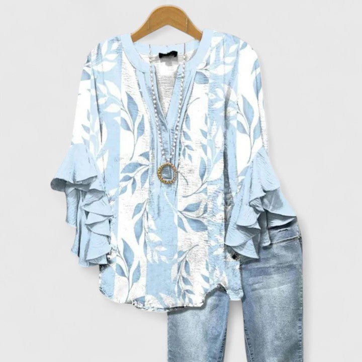 Women's blouse featuring an elegant floral print and stylish ruffled sleeves, designed for breathability and versatility in various settings. 6