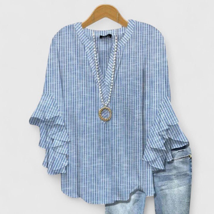 Women's blouse featuring an elegant floral print and stylish ruffled sleeves, designed for breathability and versatility in various settings. 2