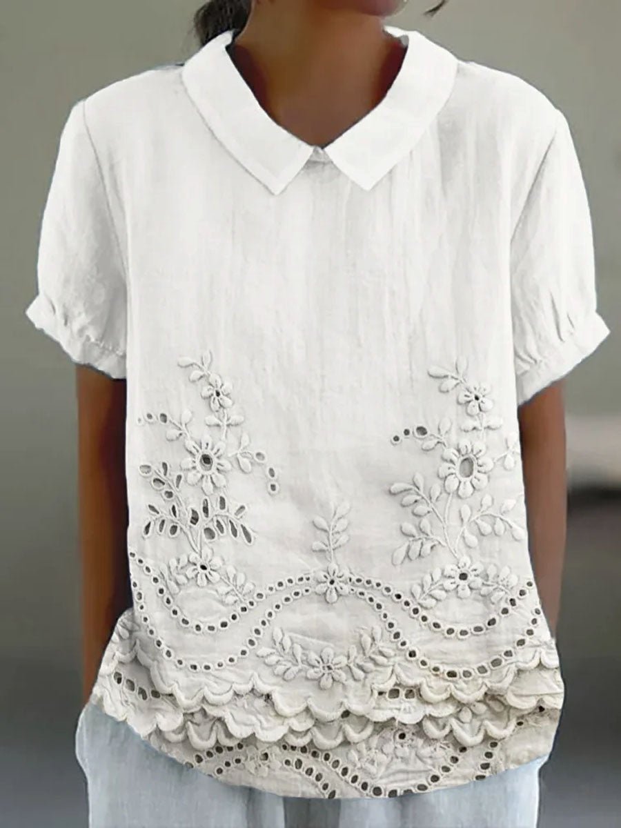 Womens blouse featuring delicate floral embroidery in a soft pink cotton linen blend with a relaxed fit. 1