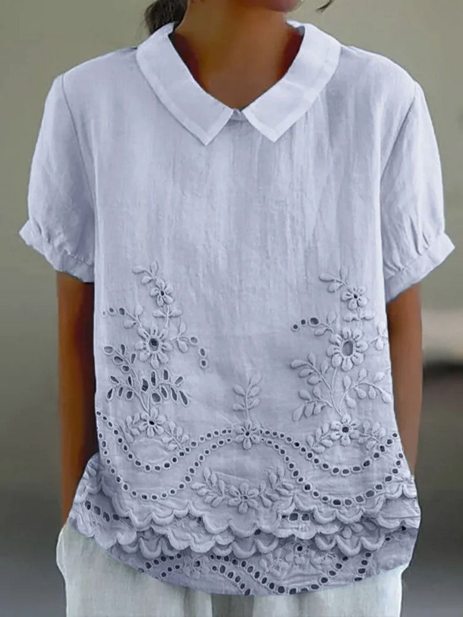 Womens blouse featuring delicate floral embroidery in a soft pink cotton linen blend with a relaxed fit. 2