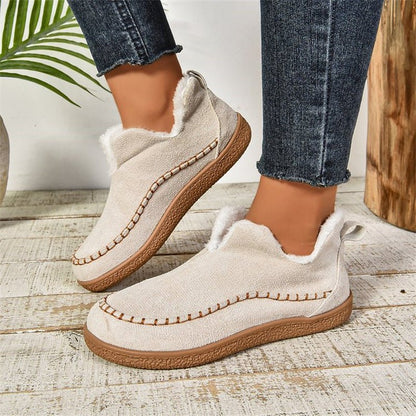Women's slip-on ankle-high boots featuring a stylish textured sole, perfect for casual everyday wear. 1