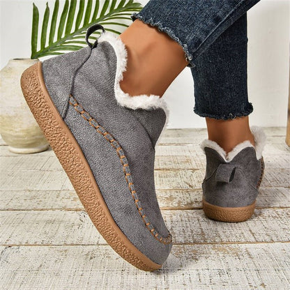 Women's slip-on ankle-high boots featuring a stylish textured sole, perfect for casual everyday wear. 4