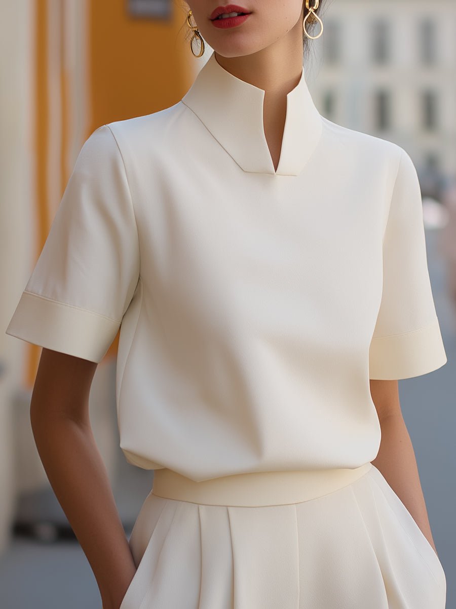 Women's business blouse featuring a stylish stand-up collar and short sleeves, perfect for elegant professional wear in the office or business meetings. 0
