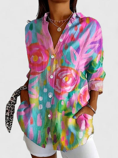 Women's button-up blouse featuring an artistic print, designed for versatility and elegance, perfect for both casual and formal occasions. 0