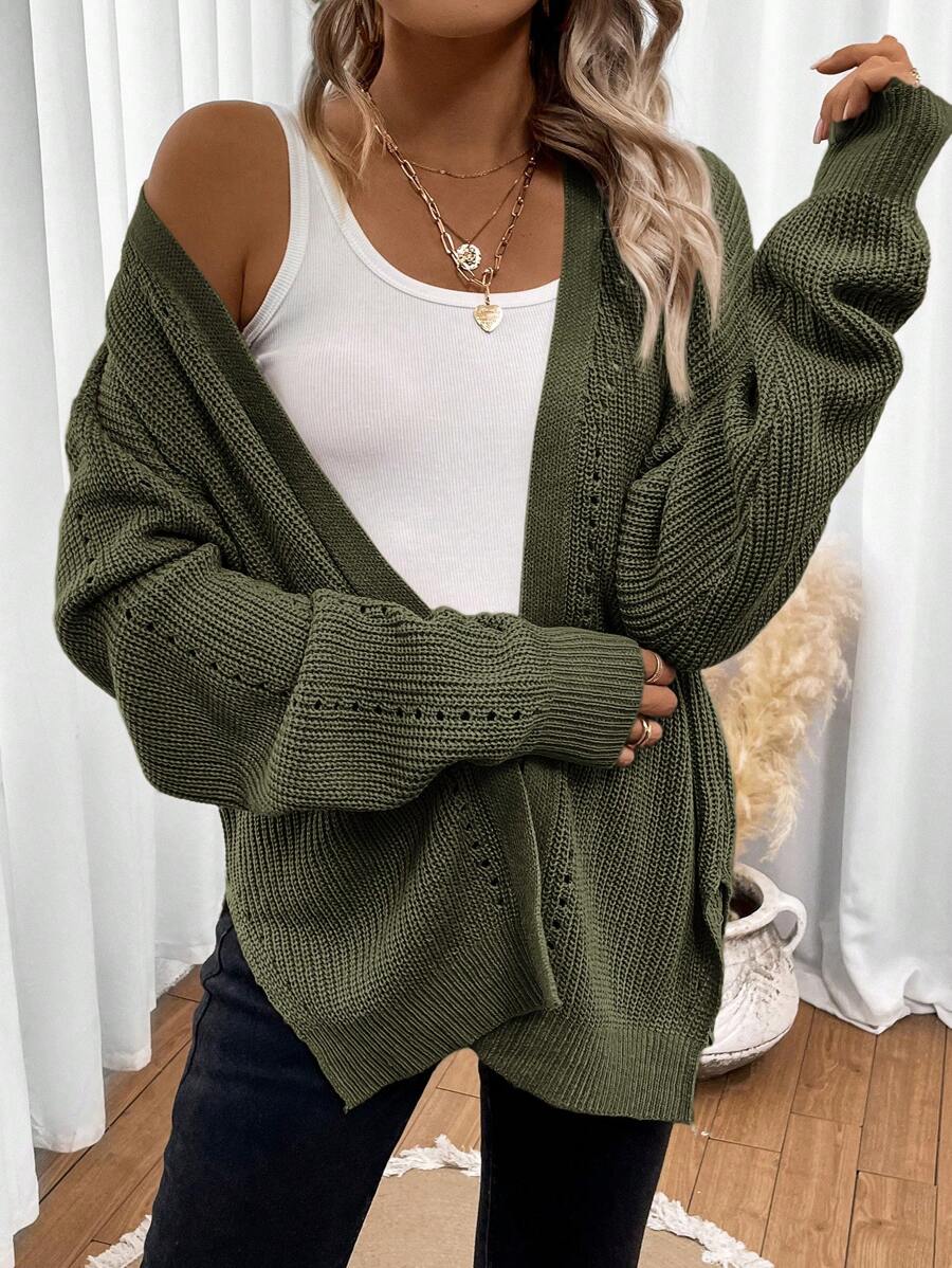 Women's white cardigan featuring pointelle knit design and drop shoulders, perfect for casual layering in any season. 1