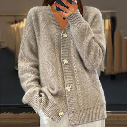 Women's cardigan featuring a stylish V-neck design, crafted from a soft wool-blend fabric, perfect for cozy layering in any season. 2