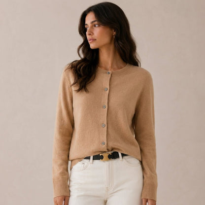 Women's cashmere cardigan featuring a button front and round neck, designed in a fitted style for versatile layering, perfect for both casual and formal occasions. 6