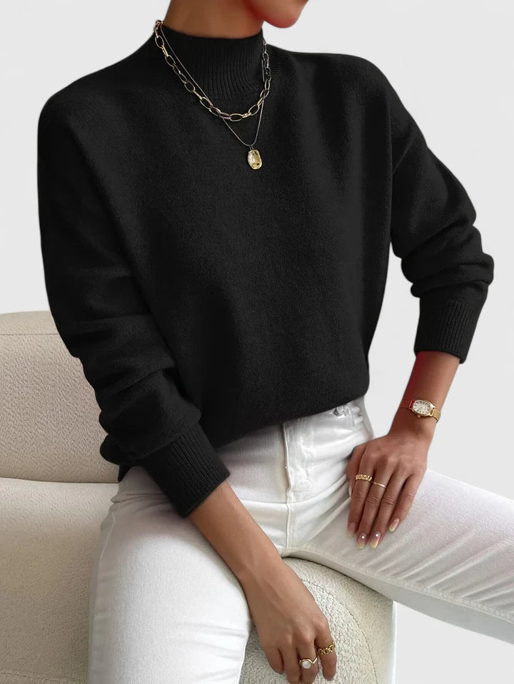 Women's cashmere turtleneck sweater in elegant black, featuring a cozy knit design perfect for timeless style and comfort. 1