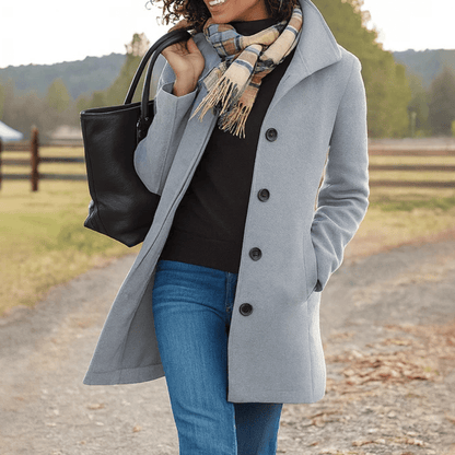 Elegant women's tailored overcoat with button front, made of warm wool, perfect for winter fashion and layering. 1