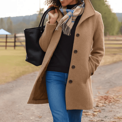 Elegant women's tailored overcoat with button front, made of warm wool, perfect for winter fashion and layering. 0