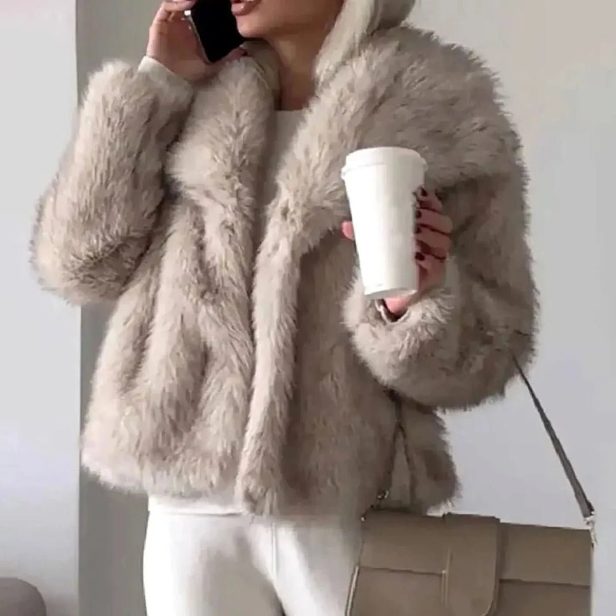 Women's cropped faux fur jacket with an open front, featuring a soft plush texture, perfect for autumn and winter layering. 1