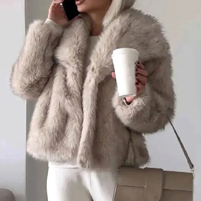 Women's cropped faux fur jacket with an open front, featuring a soft plush texture, perfect for autumn and winter layering. 1