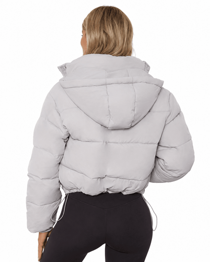 Women's cropped hooded puffer jacket featuring a zip closure and quilted insulated design, perfect for winter warmth and style. 5