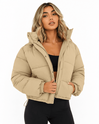 Women's cropped hooded puffer jacket featuring a zip closure and quilted insulated design, perfect for winter warmth and style. 2