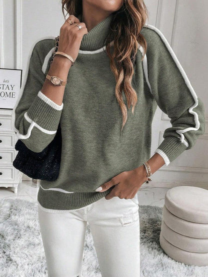 Women's cropped turtleneck jumper featuring a stylish ribbed knit texture and trendy striped sleeves, perfect for a fashionable and cozy look. 1