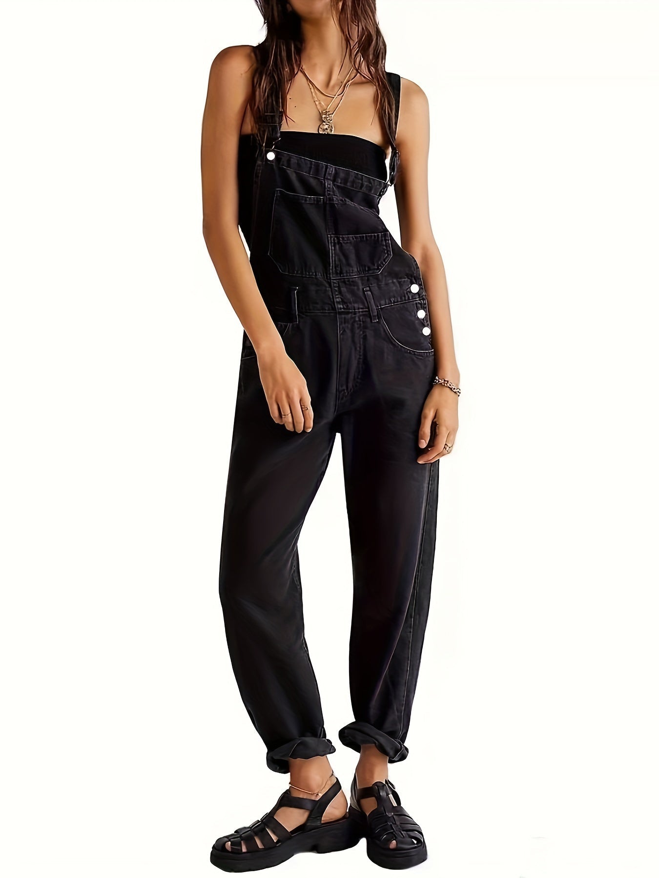 Women's denim jumpsuit featuring a casual relaxed fit, designed with functional pockets, perfect for all seasons. 2