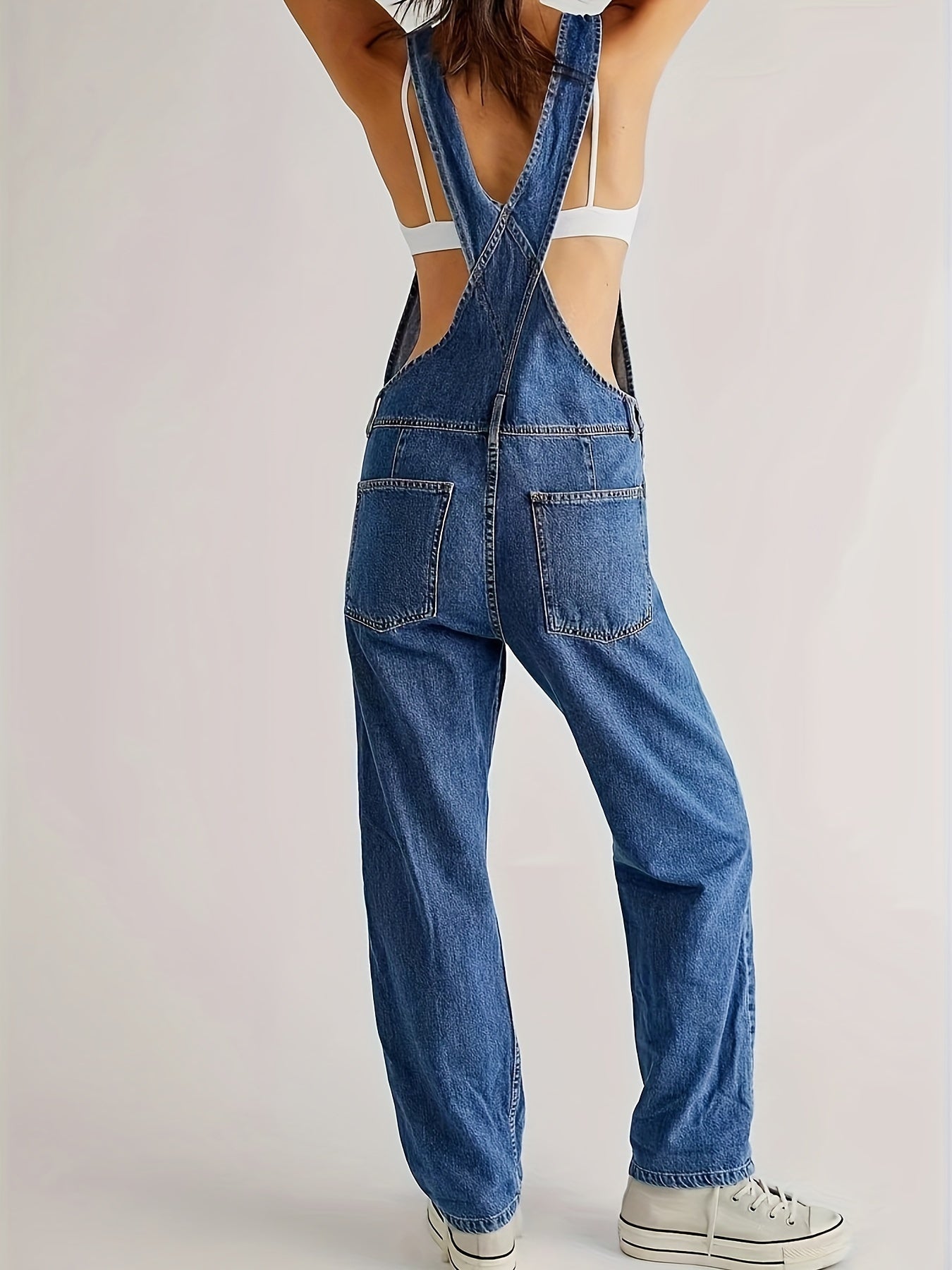 Women's denim jumpsuit featuring a casual relaxed fit, designed with functional pockets, perfect for all seasons. 6