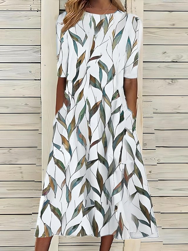 Women’s A-Line mid-length summer dress featuring a vibrant floral print, perfect for casual outings and warm weather occasions. 2