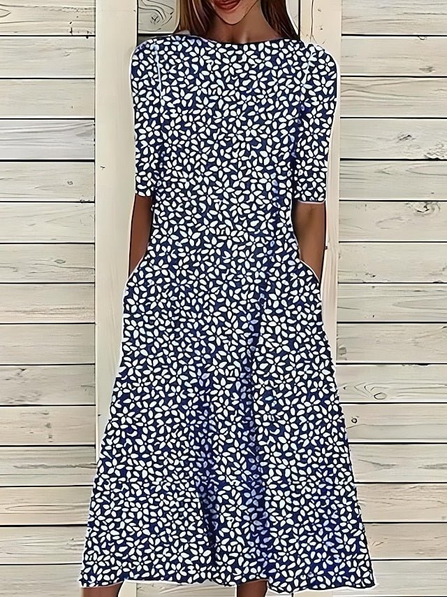 Women’s A-Line mid-length summer dress featuring a vibrant floral print, perfect for casual outings and warm weather occasions. 1