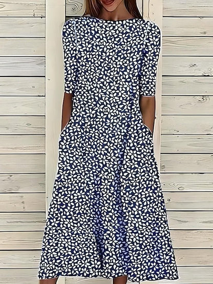 Women’s A-Line mid-length summer dress featuring a vibrant floral print, perfect for casual outings and warm weather occasions. 1
