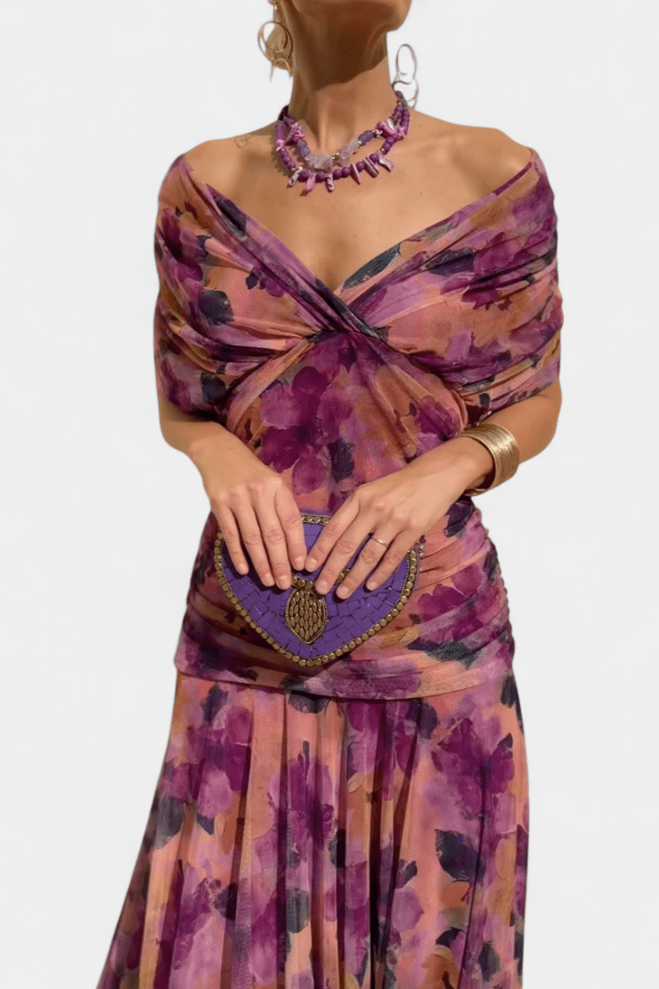 Floral print women's dress for weddings and events featuring a V-neckline, pleated waist, and a long flowing skirt. 10